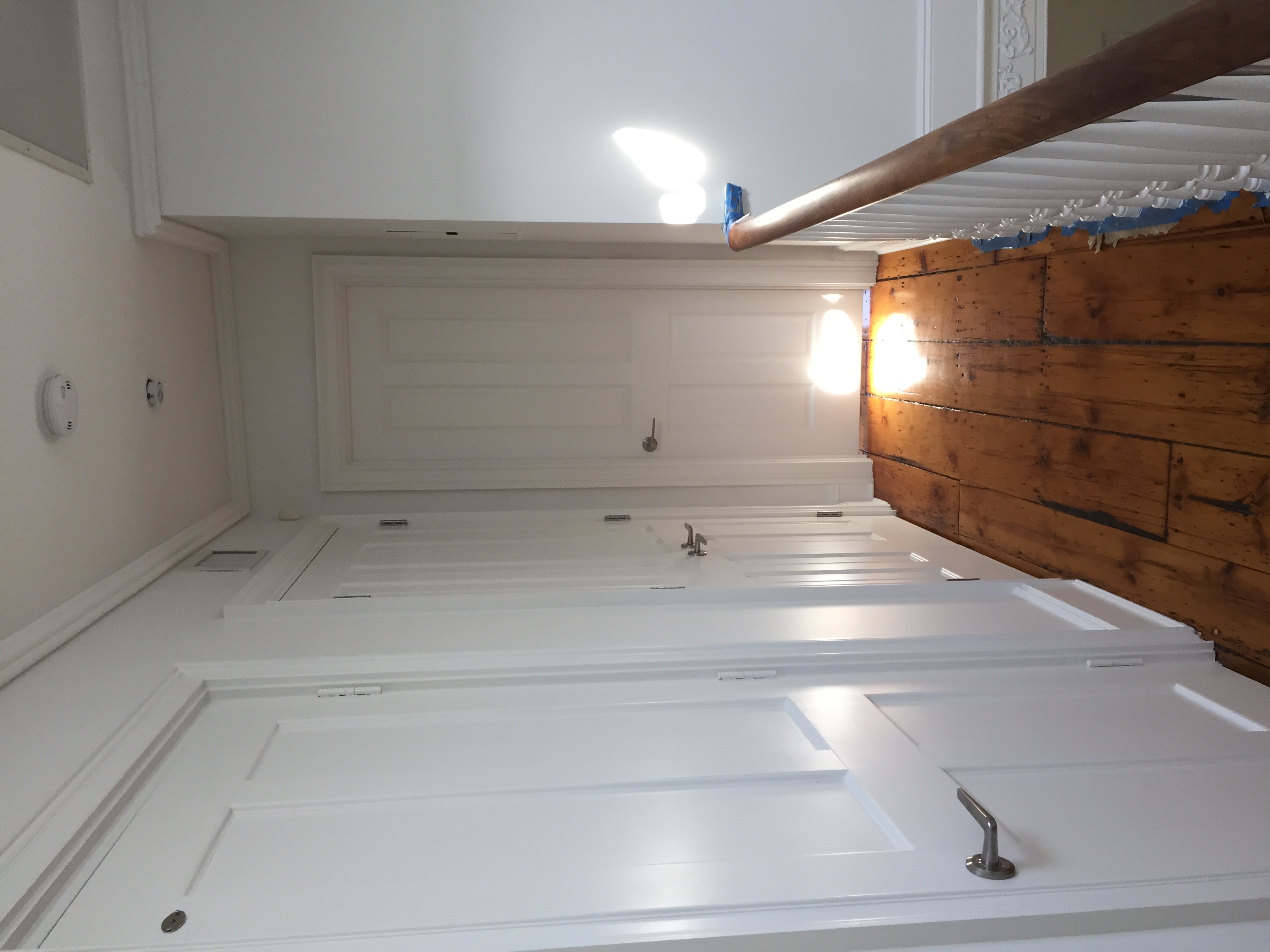 Painted hallway with doors and molding