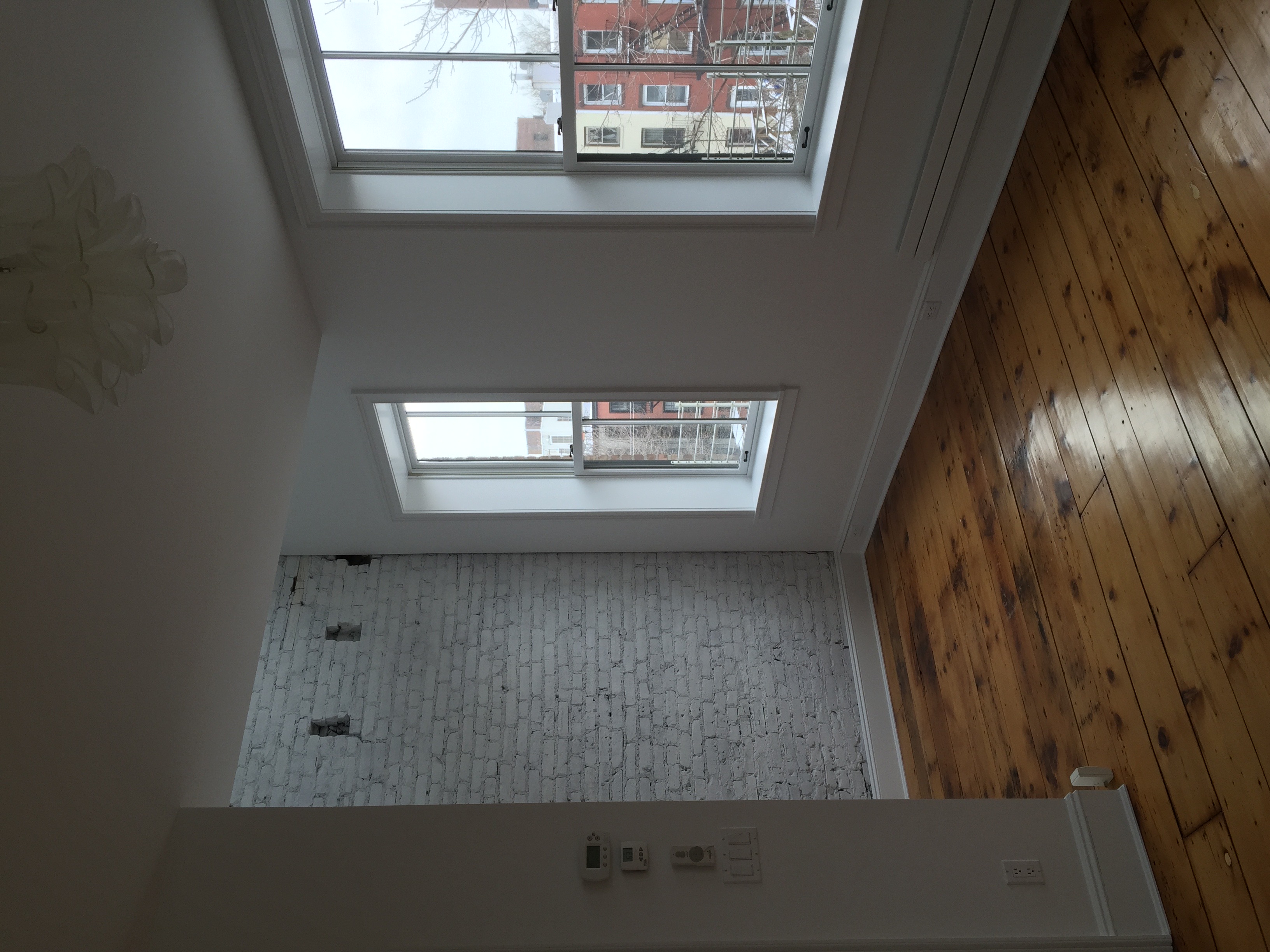 Apartment with painted brick wall